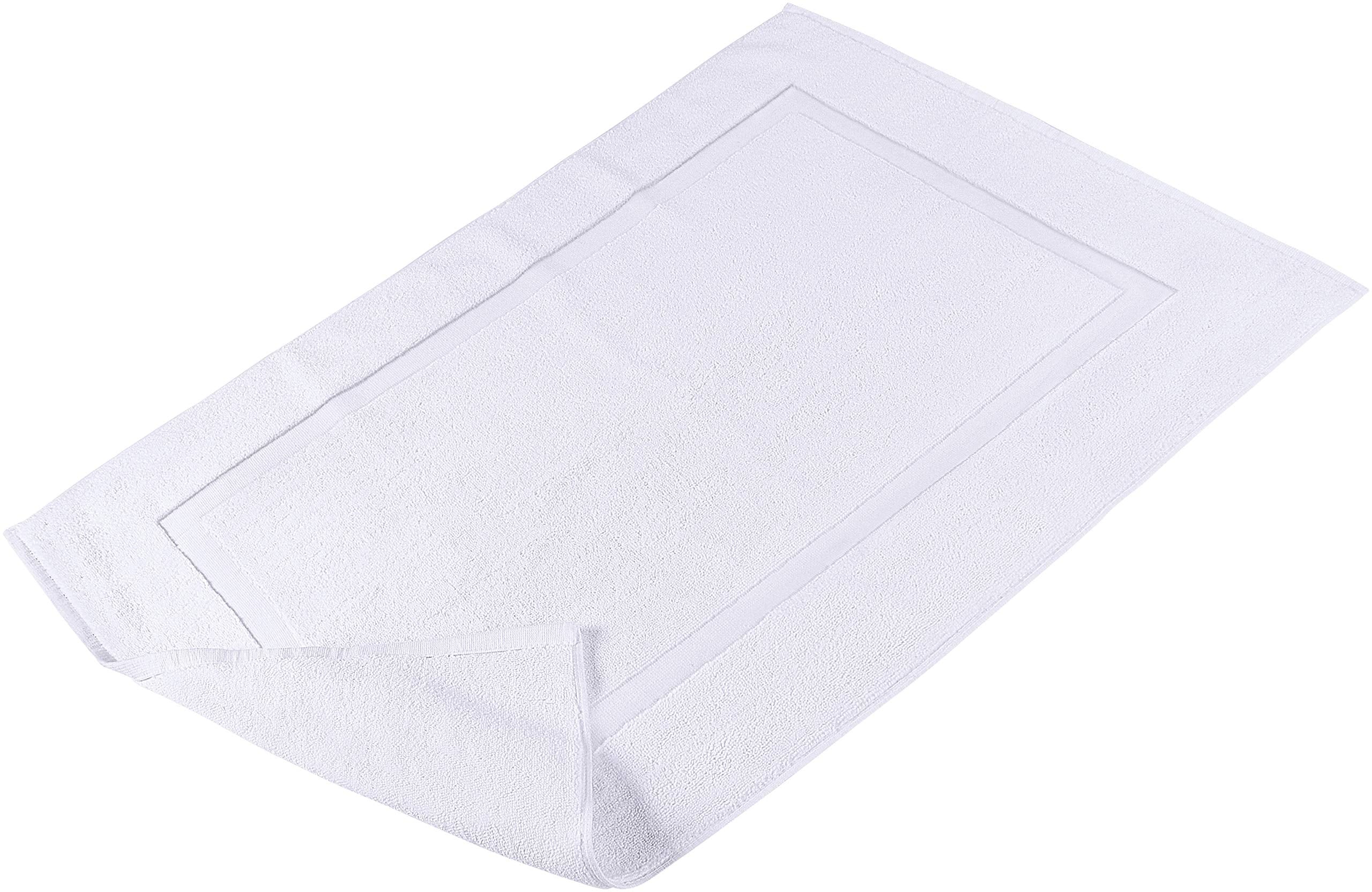 Care label close-up on Utopia Towels mat indicating machine-washable convenience