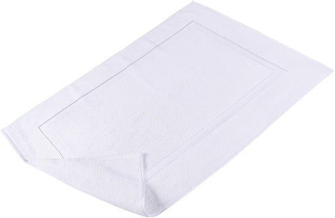 Care label close-up on Utopia Towels mat indicating machine-washable convenience