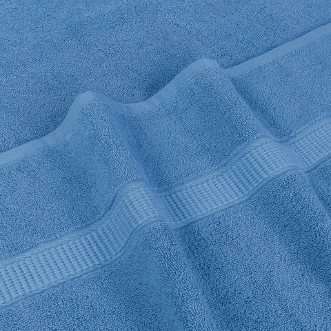 Utopia Towels laid on poolside lounge for quick dry-off and bright style