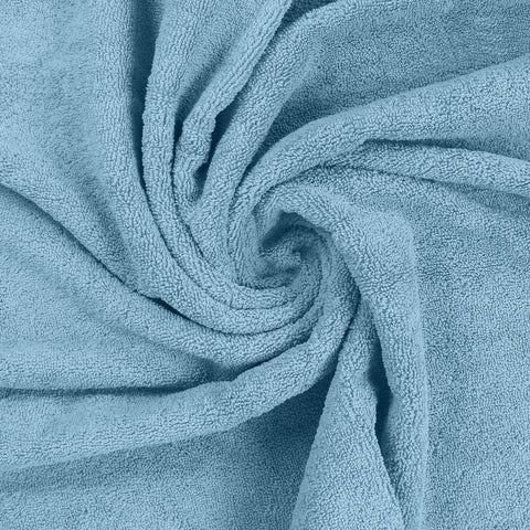 Utopia Towels compactly packed for travel showing portability advantage