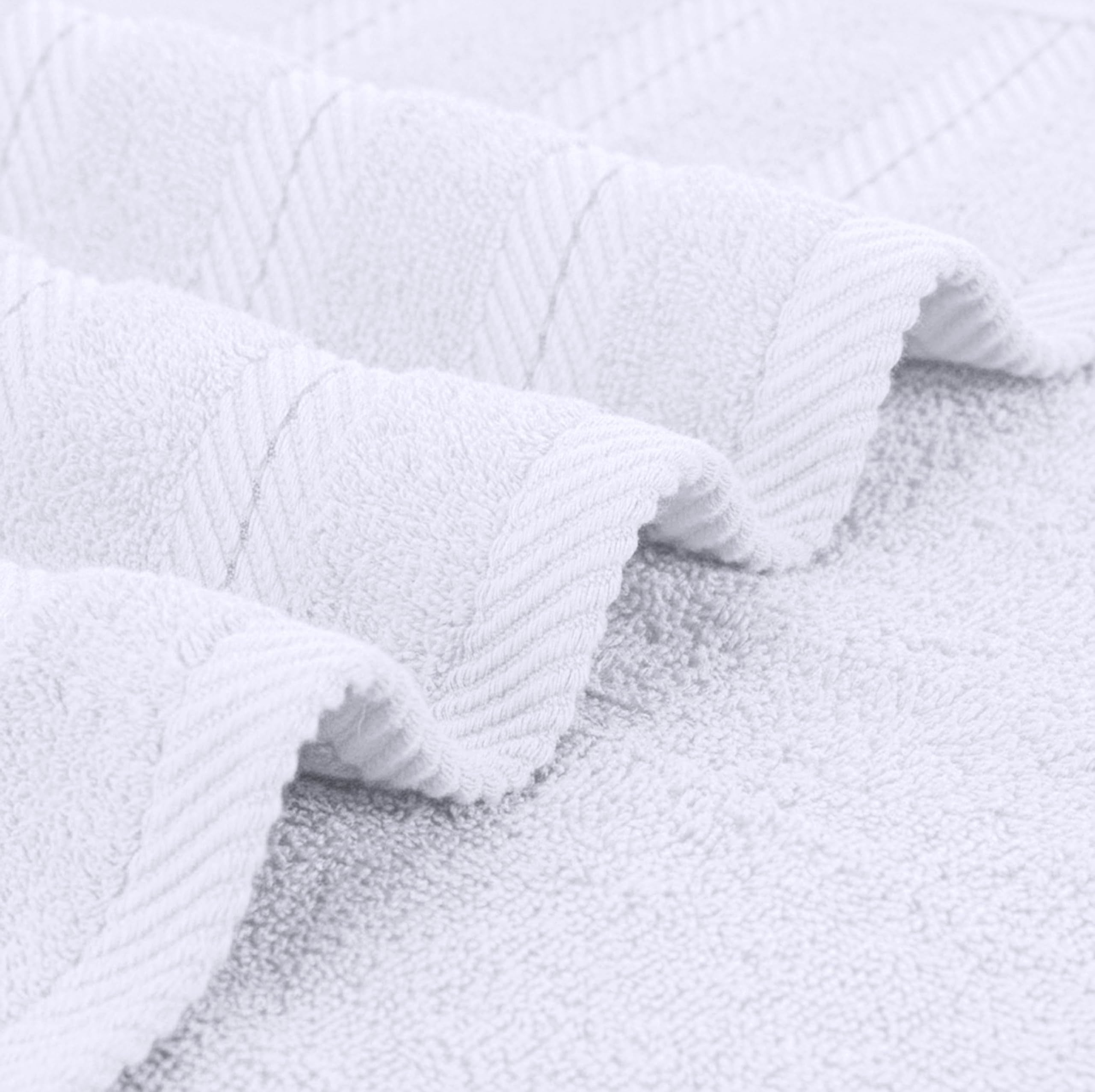 Utopia Towels arranged in a bathroom setting suggesting spa-like comfort at home
