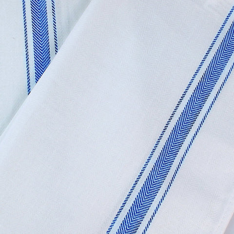 Utopia Towels next to hand showing 15 x 25 inch size for convenience