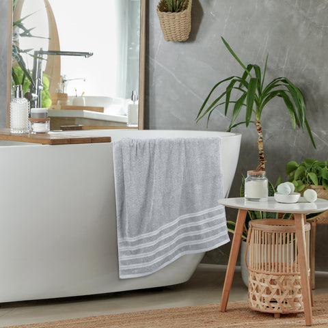 Utopia Towels beside ruler illustrating 30x60 inch extra-large size benefit