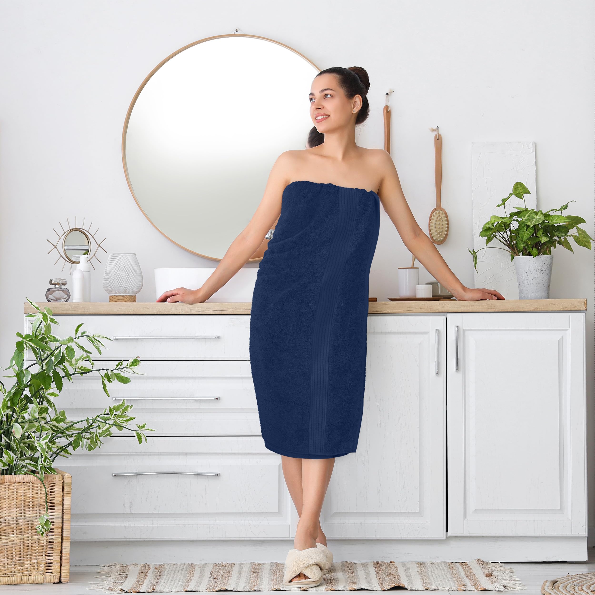 Utopia Towels next to standard towel showing larger 35x70 inch size benefit