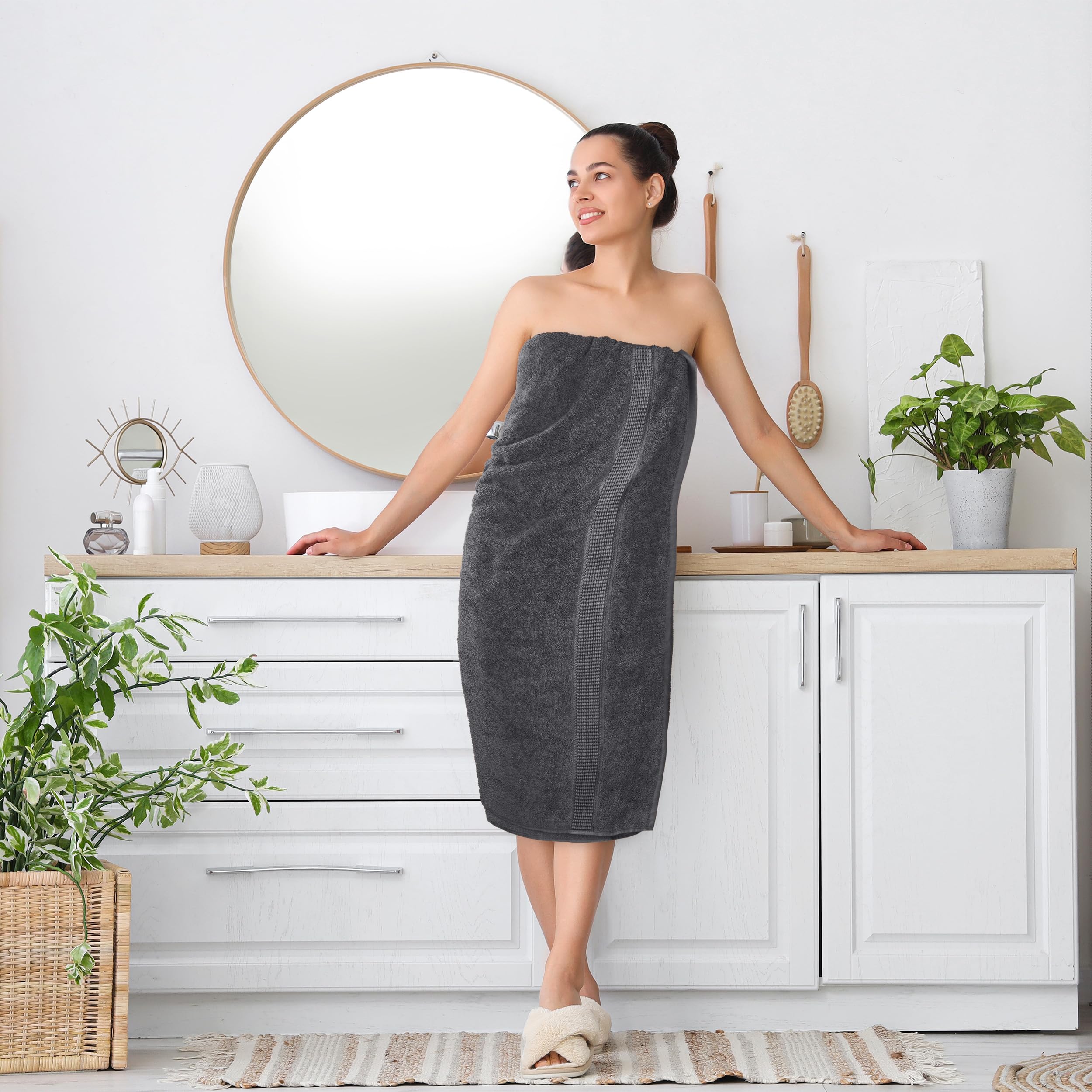 Utopia Towels size comparison on bath mat showing generous 35x70 fit