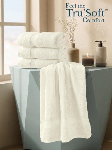 Utopia Towels next to bath mat showing 27x54 inch scale clarity