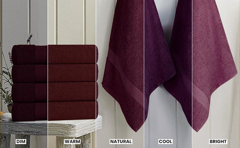 Utopia Towels beside a hand to show 24x48 inch scale and practical size