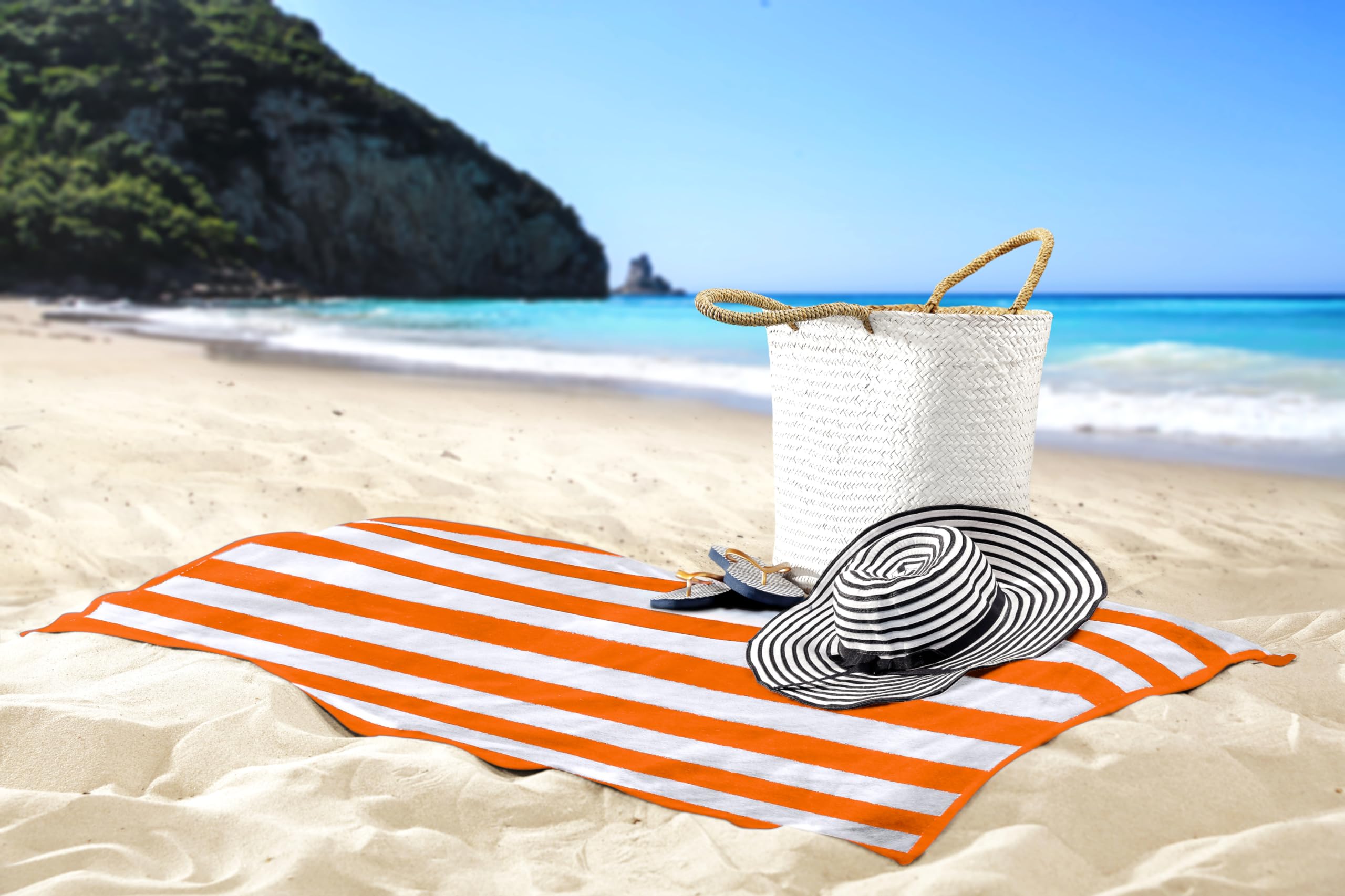 Utopia Towels next to sandal to show true-to-life 30x60 size comparison