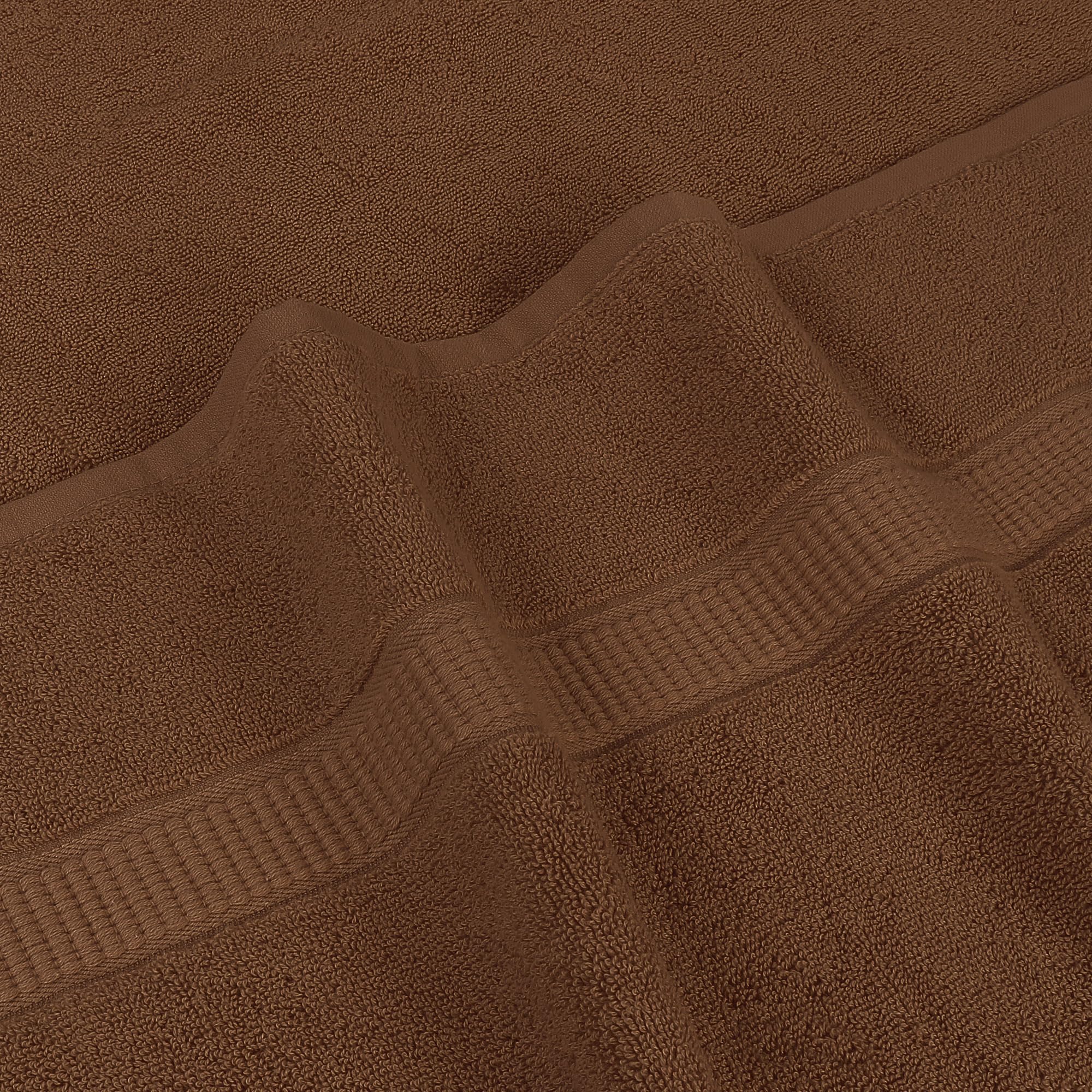 Utopia Towels next to standard towel showing extra 35x70 inch size advantage