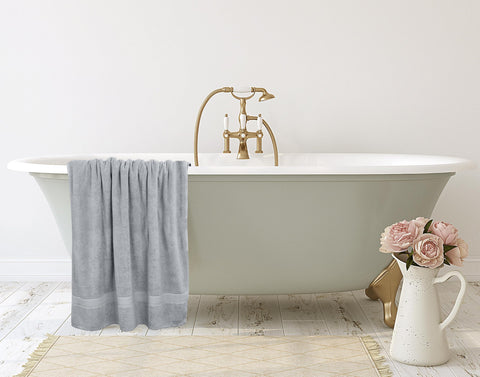 Utopia Towels side-by-side with a standard towel showing larger 35x70 inch size