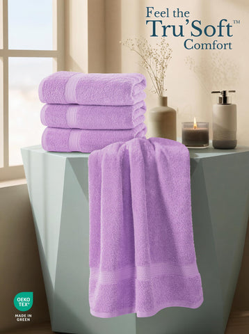 Utopia Towels folded beside ruler showing 27x54 size and easy storage benefit