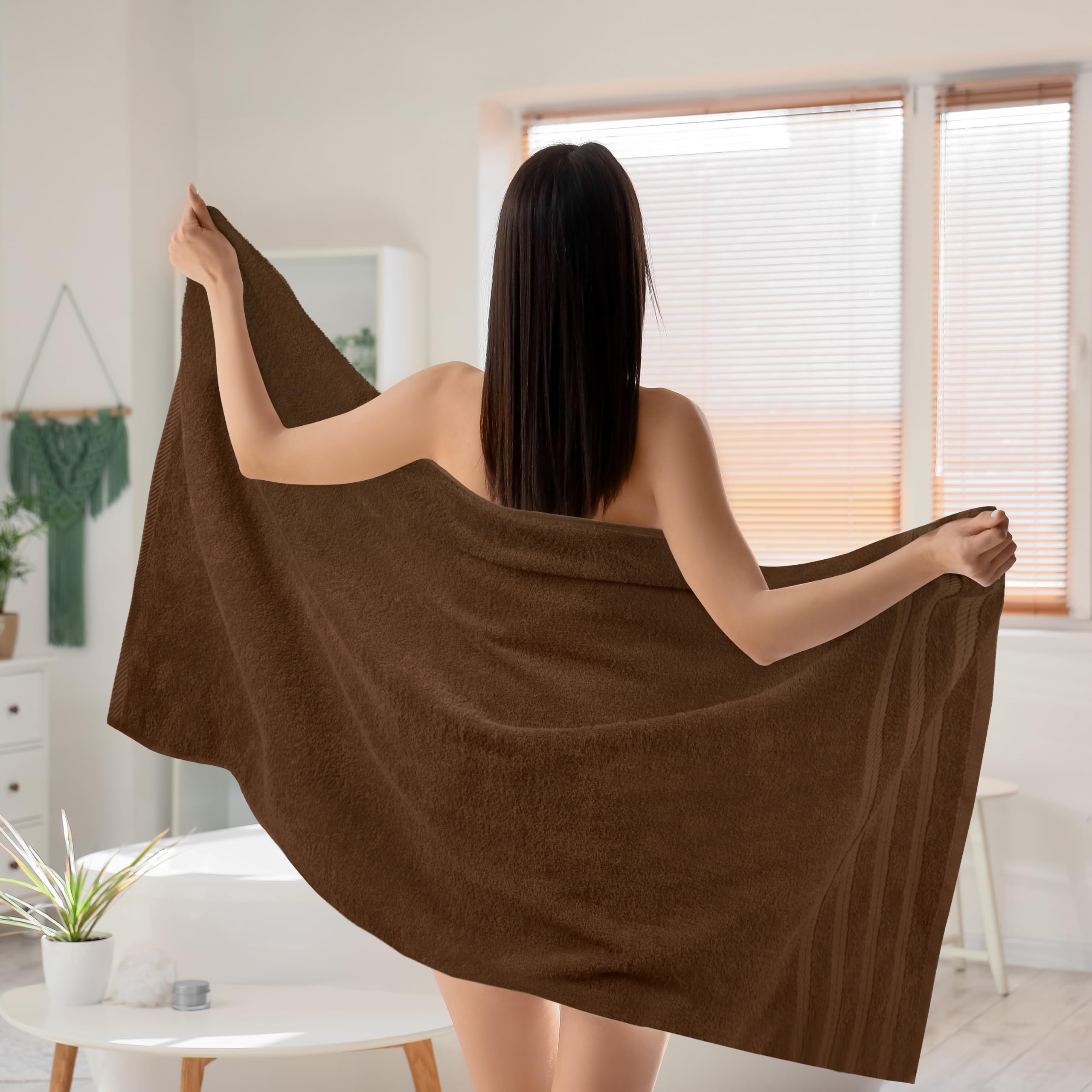Utopia Towels next to measuring tape showing 30x60 inch XL size advantage