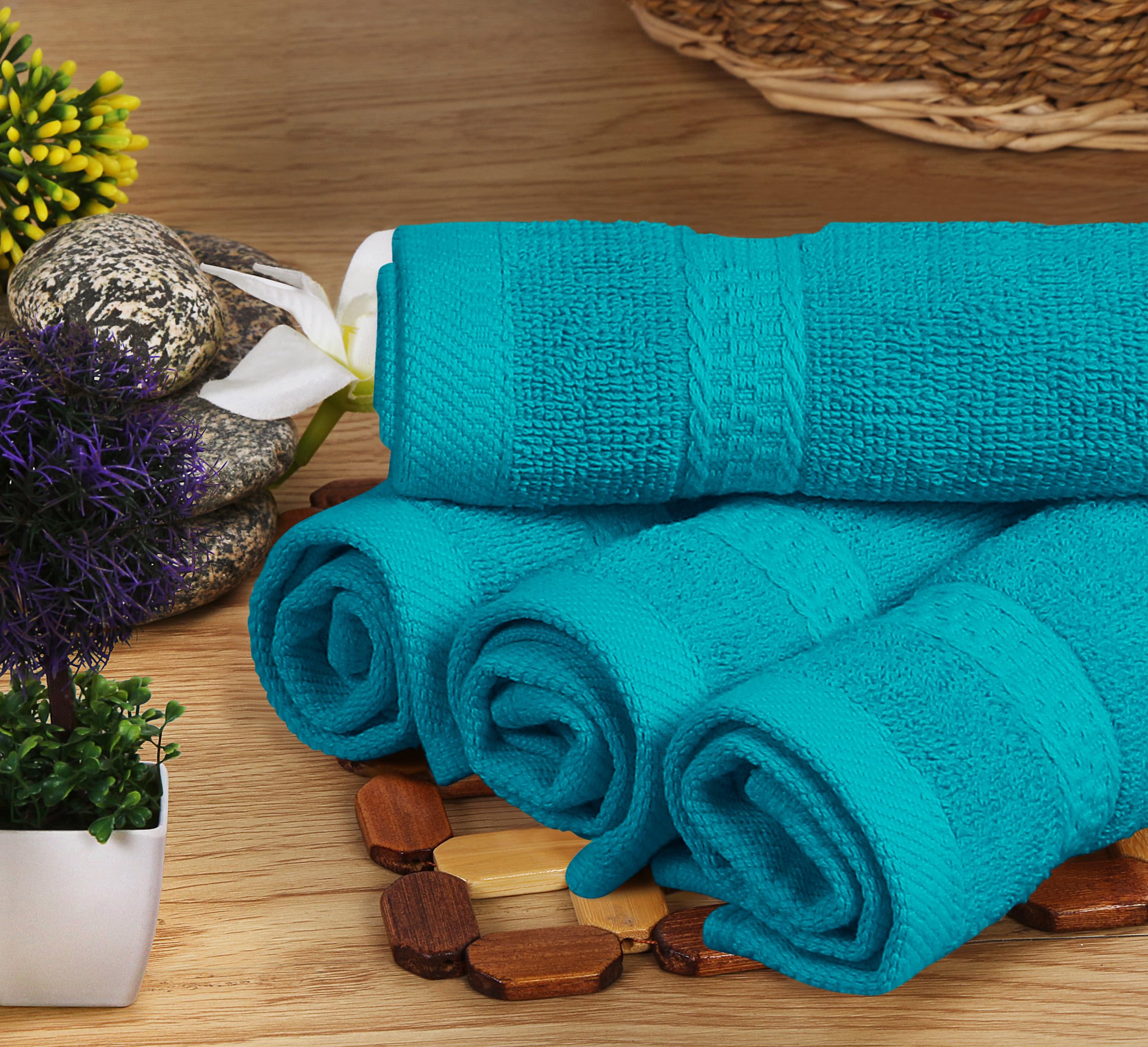 Utopia Towels beside a book showing towel scale and practical size
