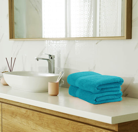 Utopia Towels neatly folded stack illustrating coordinated bathroom style