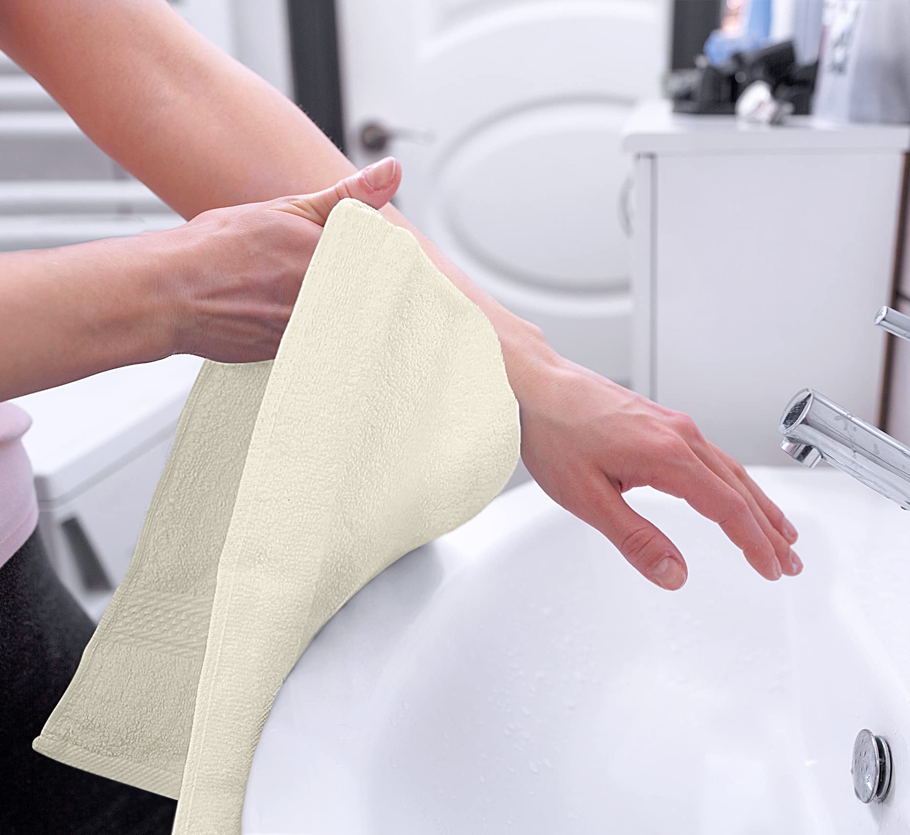 Utopia Towels being used to dry hands showing quick absorbency