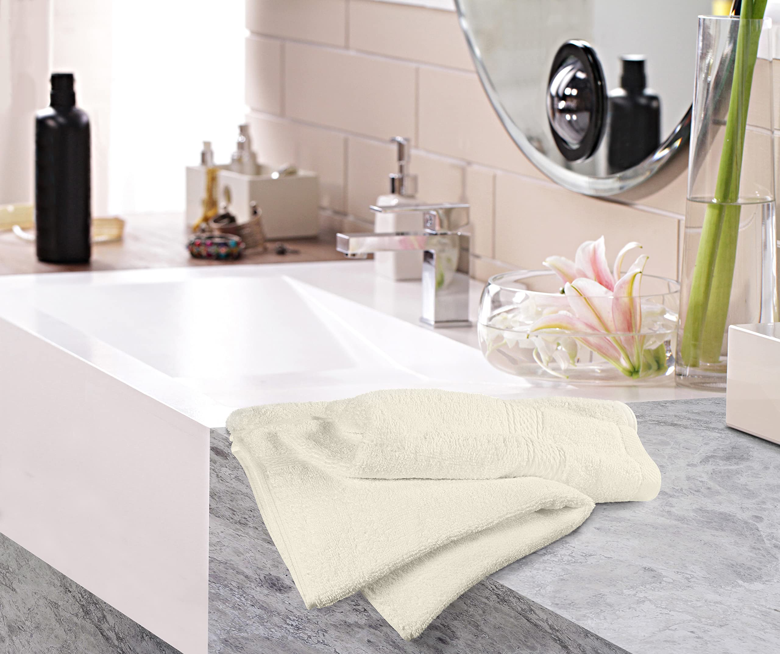 Utopia Towels styled on a towel rack in bathroom showcasing neutral ivory