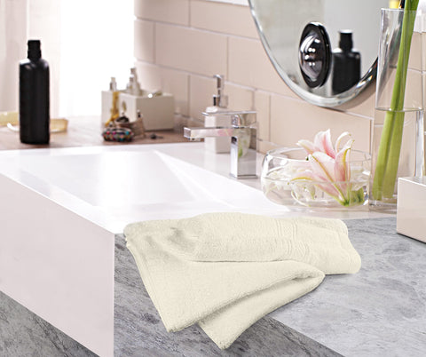 Utopia Towels styled on a towel rack in bathroom showcasing neutral ivory