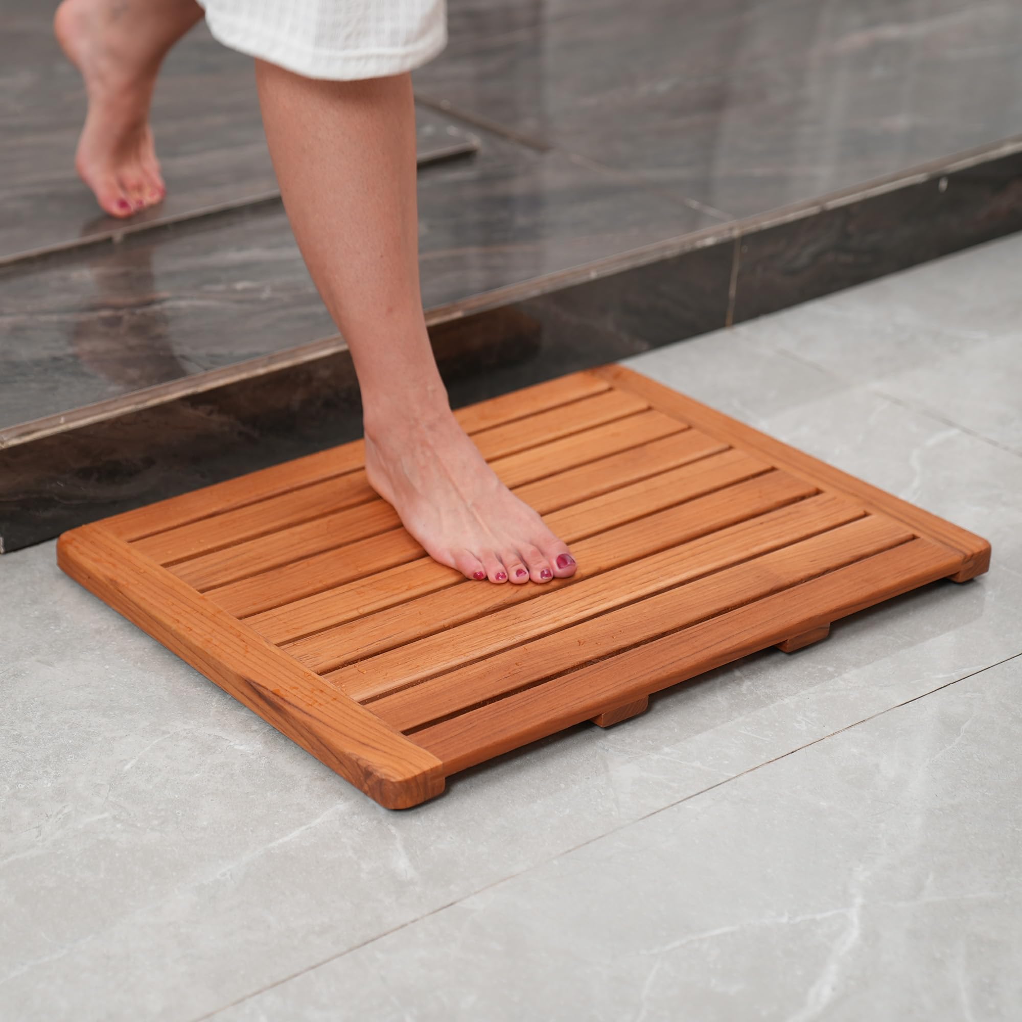 Utoplike teak mat placed in shower illustrating slip-resistant benefit