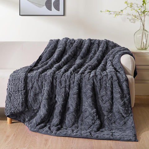 Uttermara front view showing dark grey blanket and refined jacquard for stylish comfort