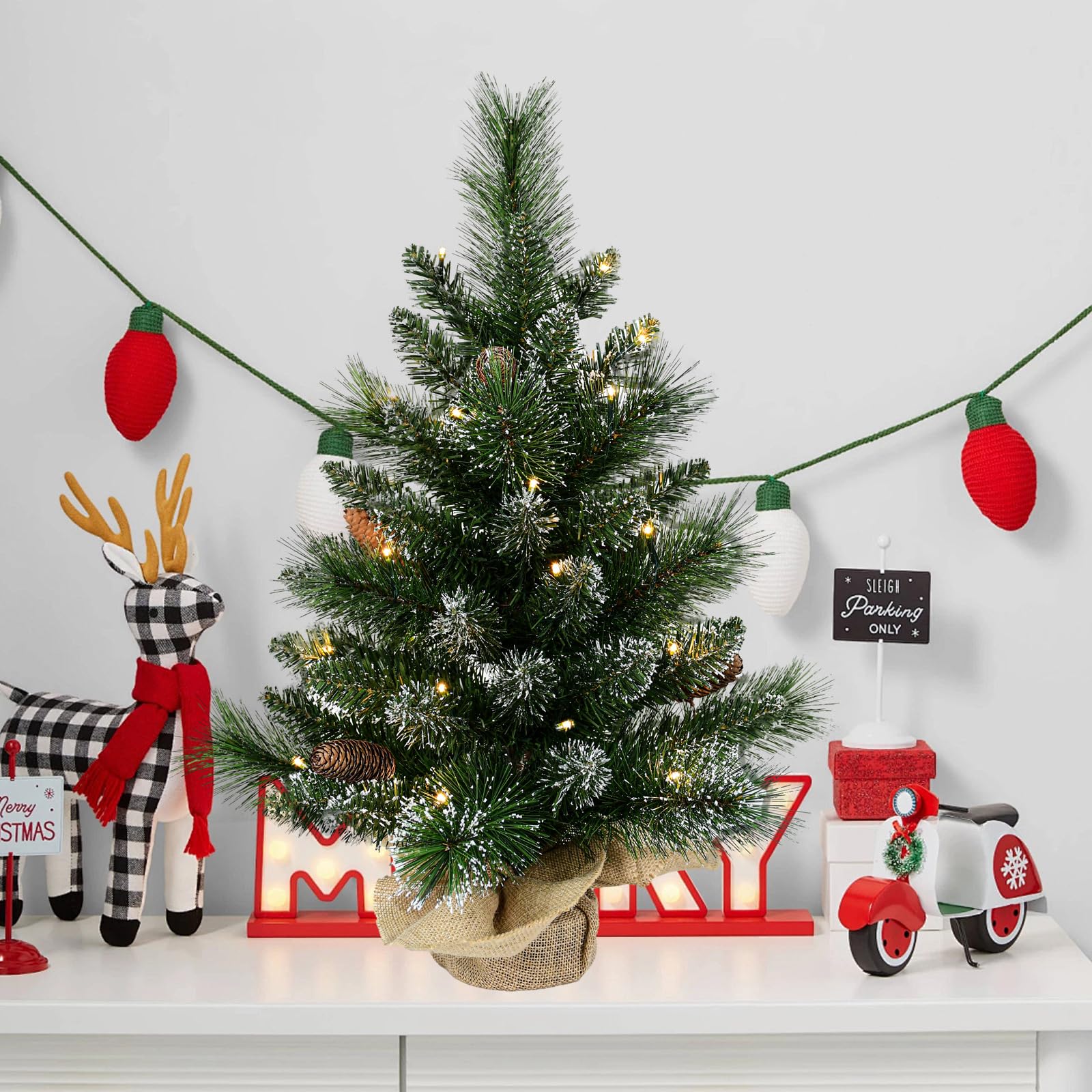 UUW tree displayed on a mantel creating festive ambiance in a living room