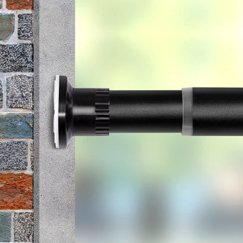 Vailge front view of full-length black tension rod showing clean profile and flexibility