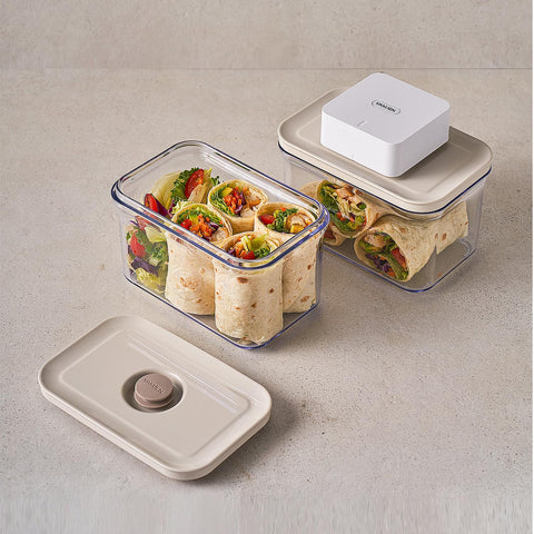 VAKUEN containers on kitchen table for meal prep convenience