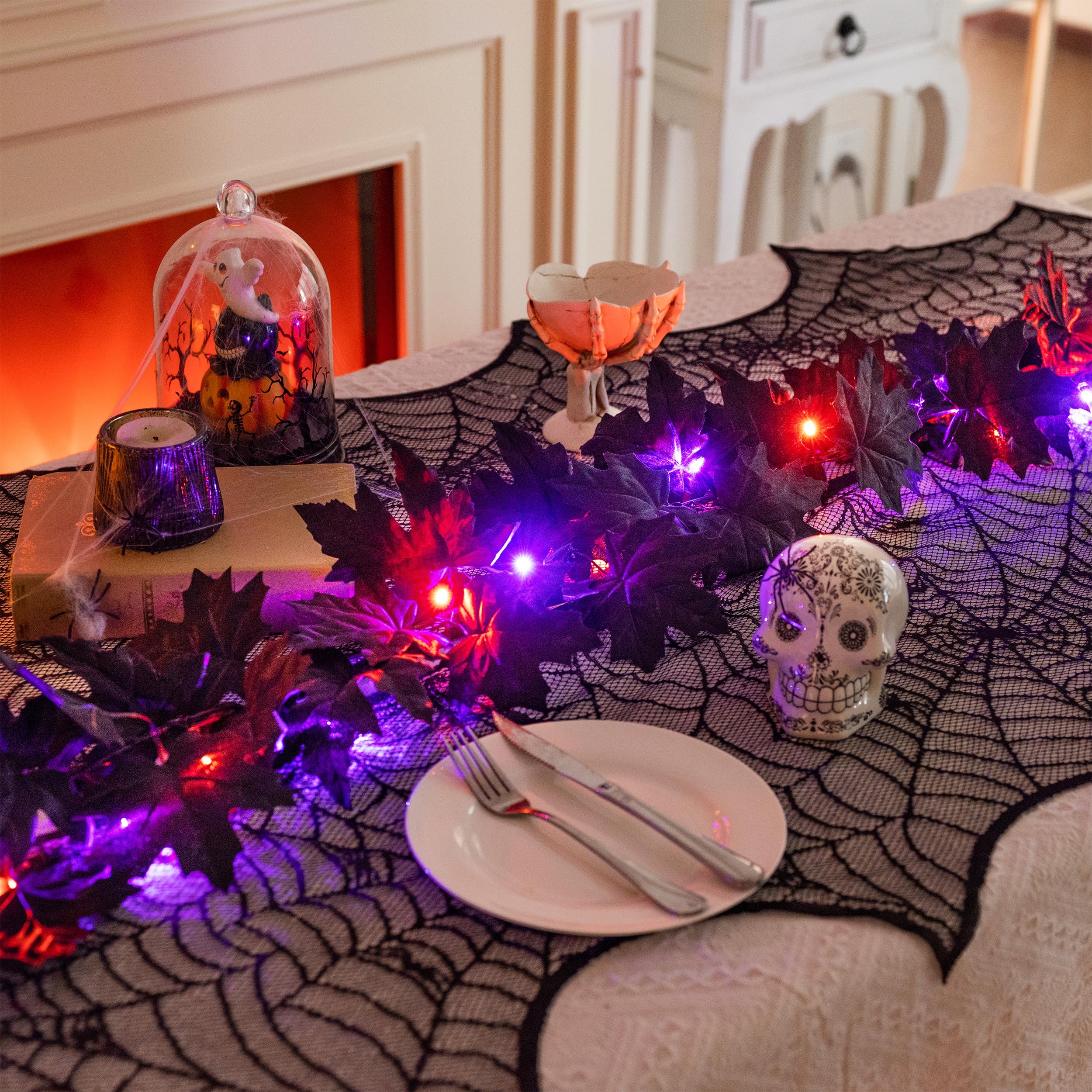 Valery Madelyn lit garland draped on mantle creating warm seasonal ambience