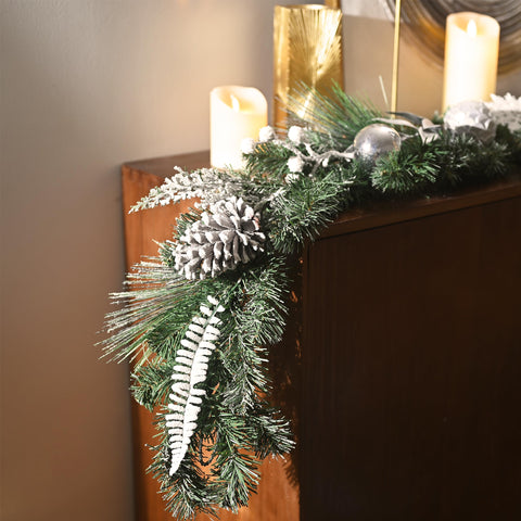 Valery Madelyn lit garland on staircase creating cozy illuminated ambience