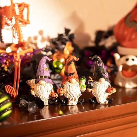 Valery Madelyn gnome holding jack-o'-lantern emphasizing festive color