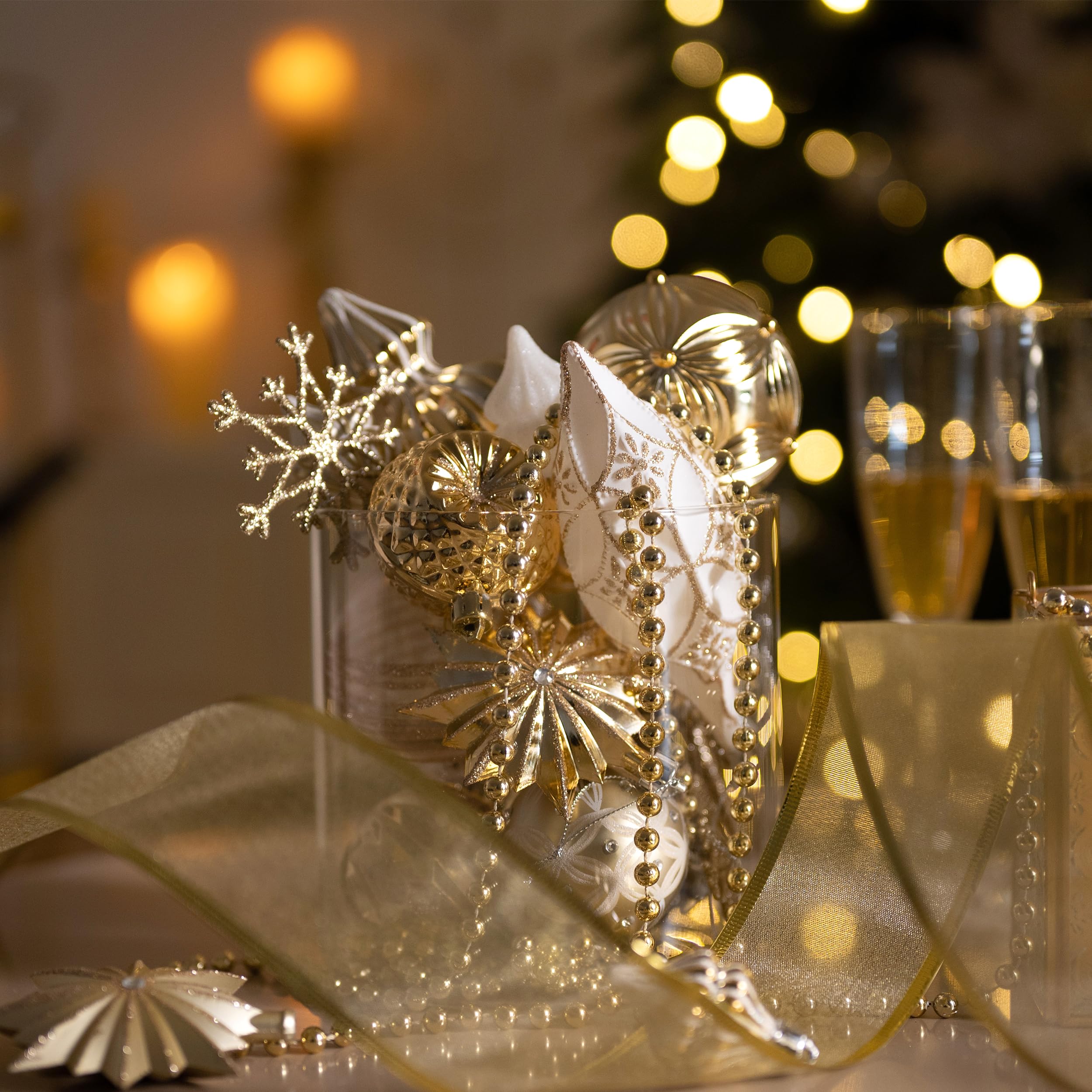 Valery Madelyn ornaments hanging on a decorated tree adding cohesive seasonal sparkle