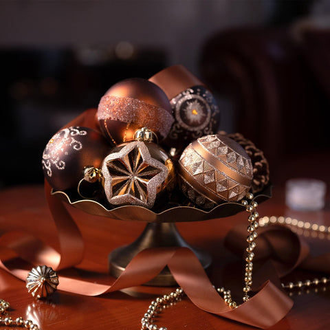 Valery Madelyn ornaments on a decorated tree adding warm metallic elegance