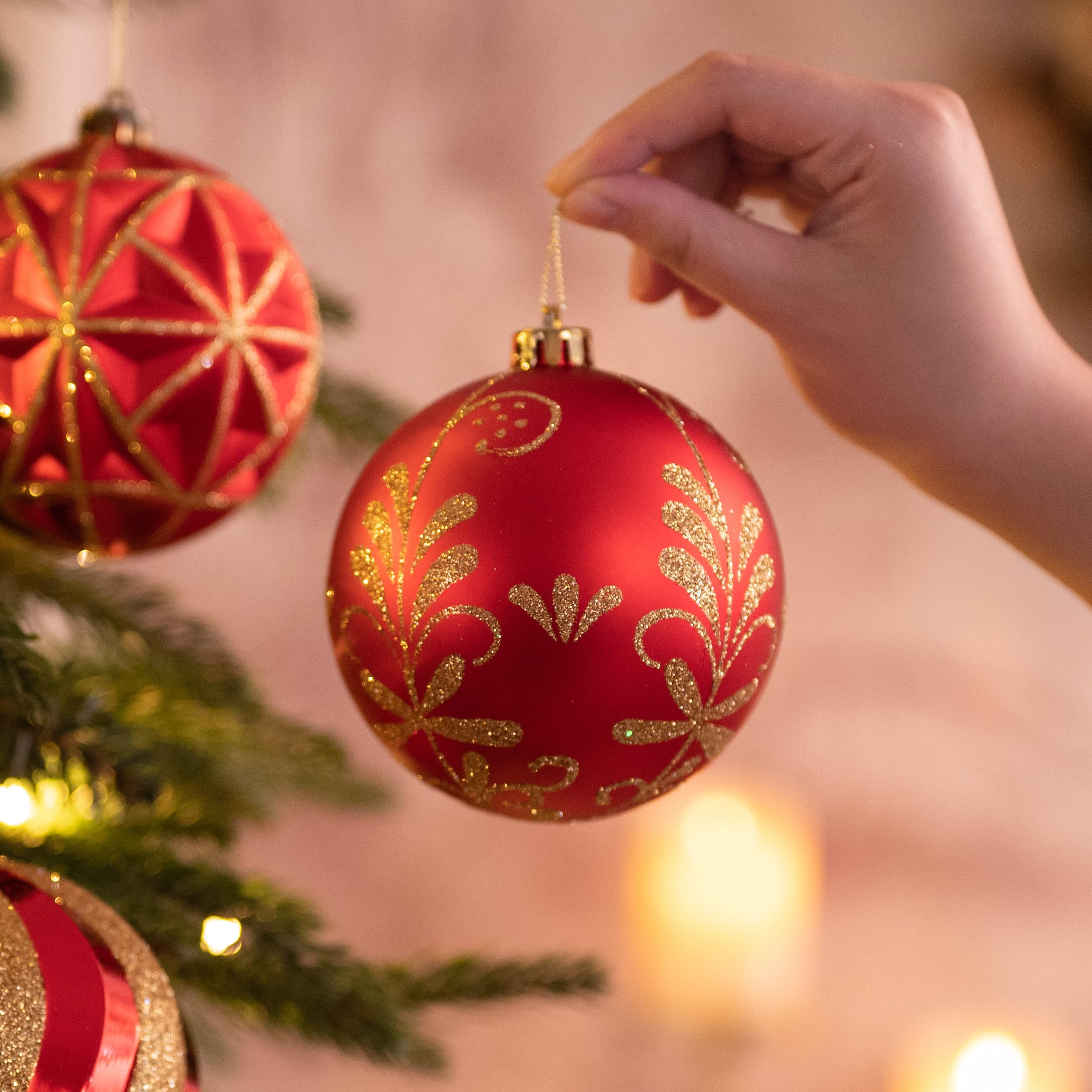 Valery Madelyn ornaments styled on a mantel with garland, creates coordinated holiday décor