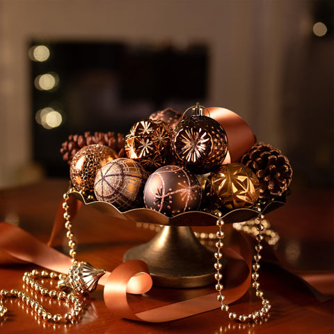 Valery Madelyn ornaments hung on an autumn-themed tree providing warm harvest ambiance
