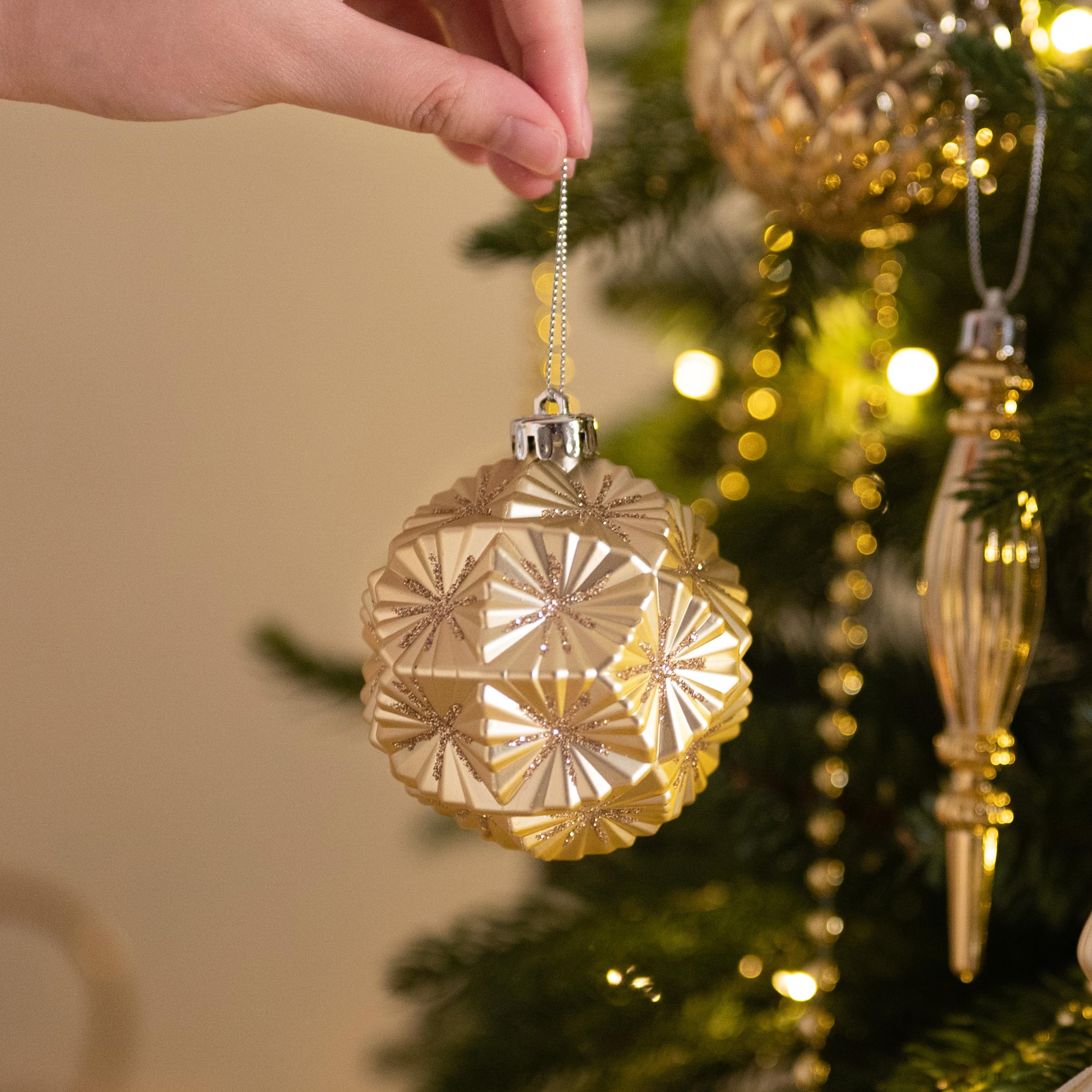 Valery Madelyn ornaments next to ruler for size and scale clarity