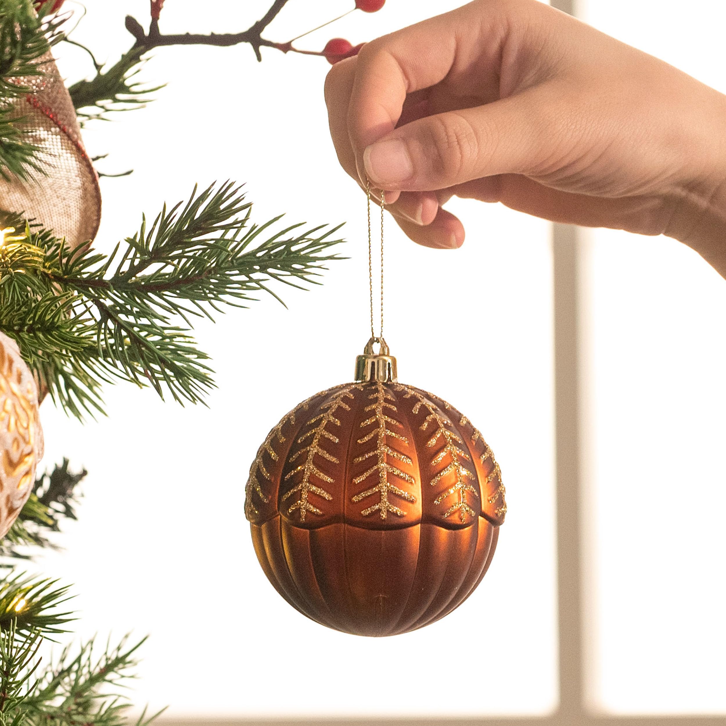 Valery Madelyn ornaments next to a ruler showing compact 2.36-inch size for versatile use