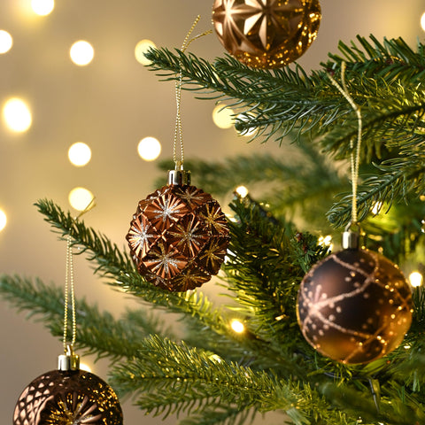 Valery Madelyn ornaments arranged in a bowl for a Thanksgiving table centerpiece adding metallic sparkle