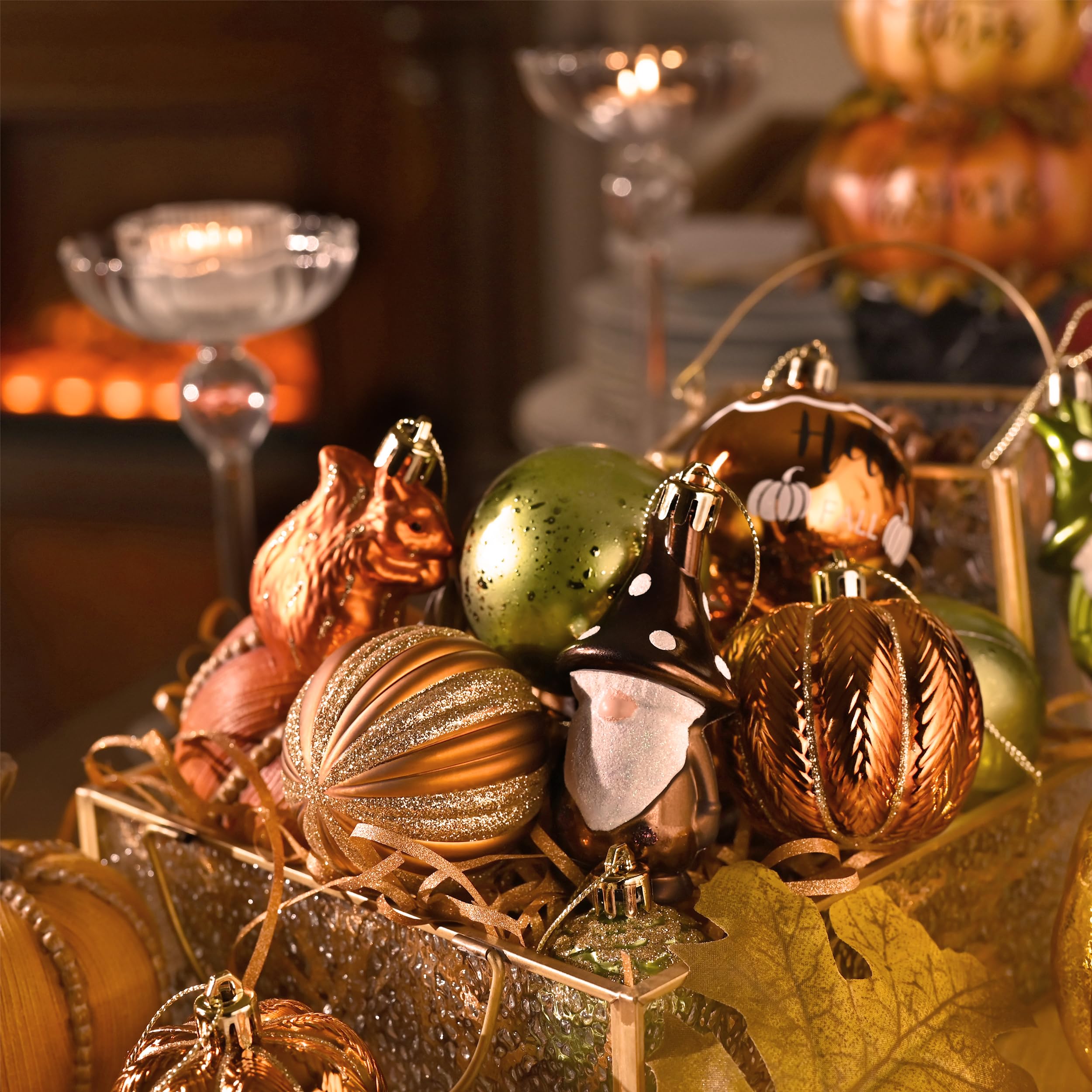 Valery Madelyn ornaments arranged on a small tree and mantel to create cozy autumn decor