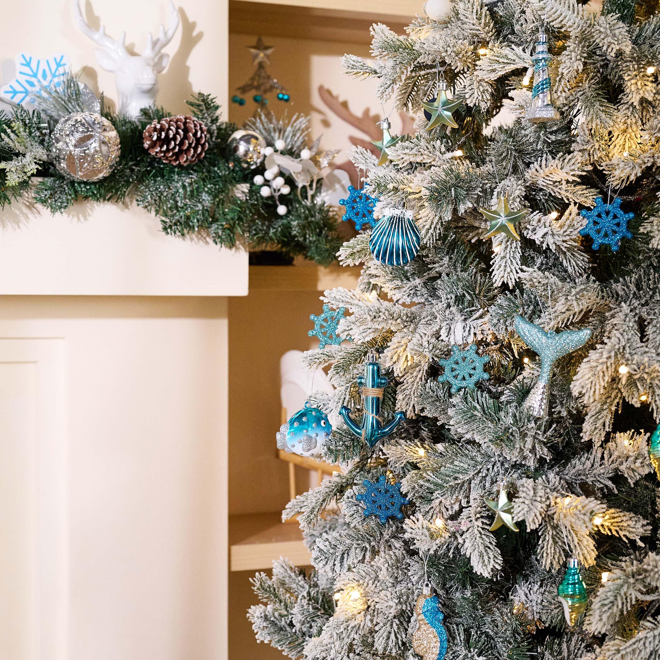 Valery Madelyn ornaments on a tree creating coastal holiday ambiance