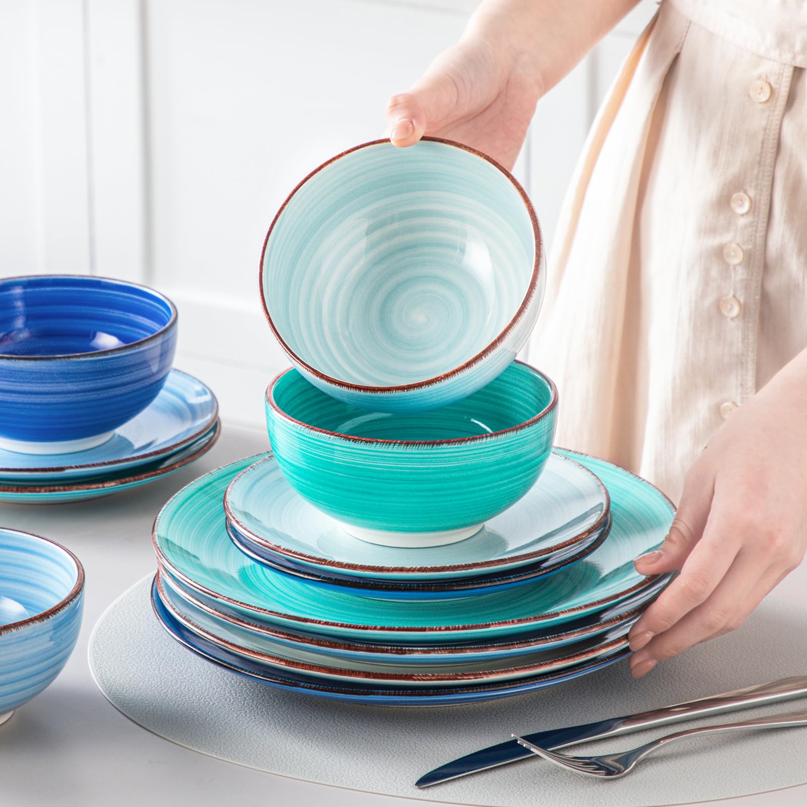 vancasso stacked plates beside utensils showing scale and storage-friendly benefit