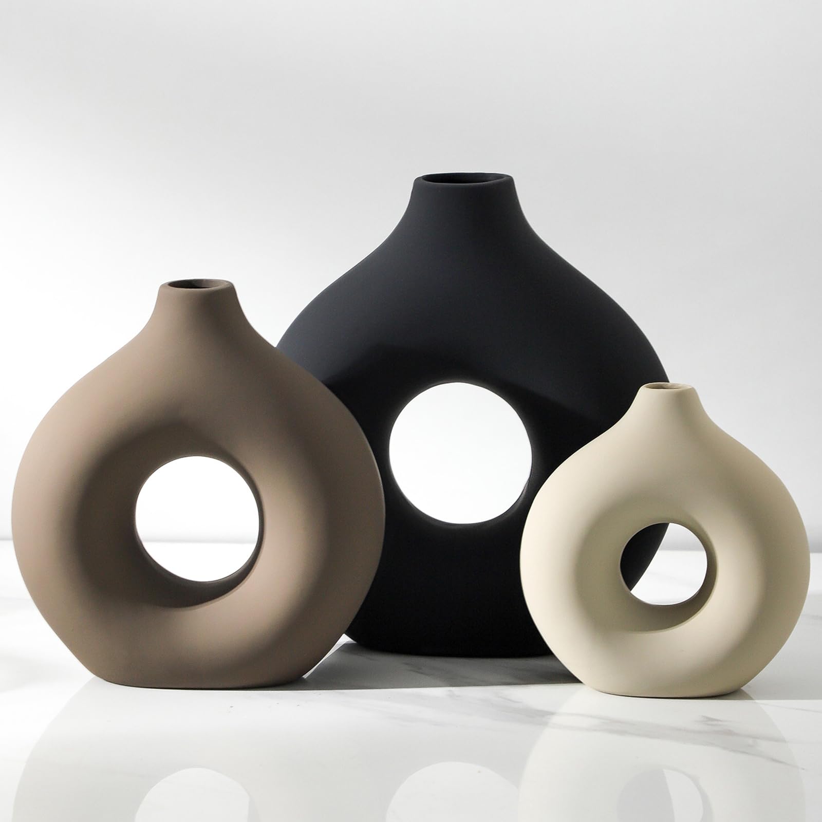 Vanselia front view of three ceramic vases showing modern centerpiece appeal