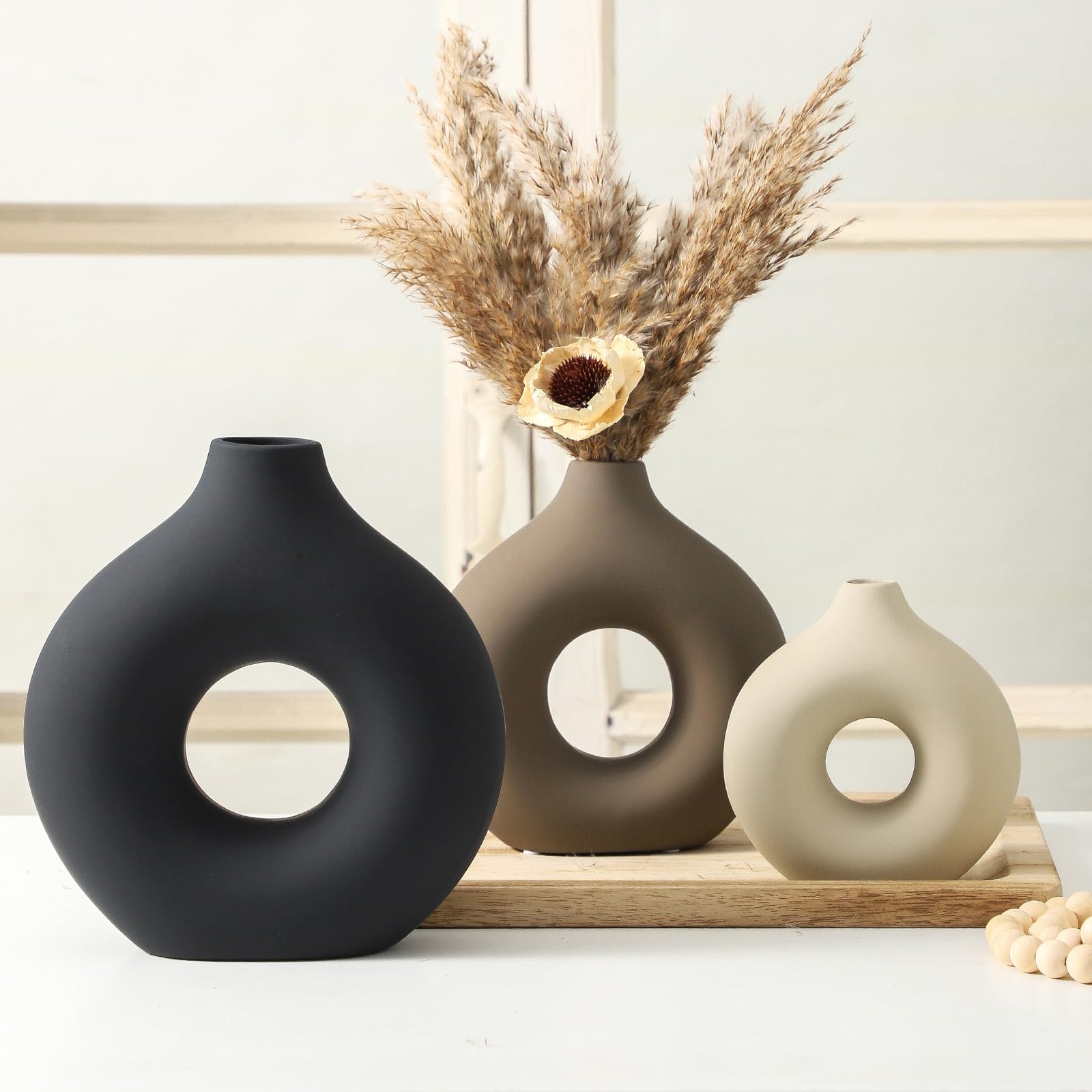 Vanselia vases styled with fresh flowers adding color and focal interest