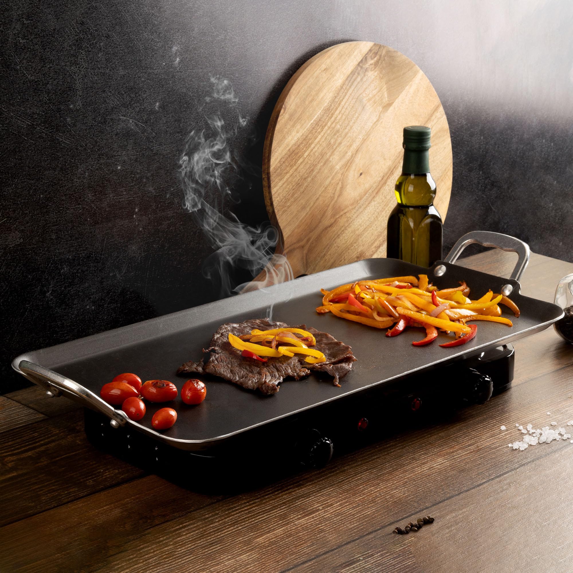 Vasconia griddle being wiped clean showing quick cleanup advantage