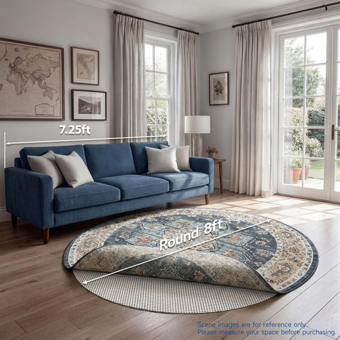 Veken 8 ft round pad next to chair showing scale and coverage
