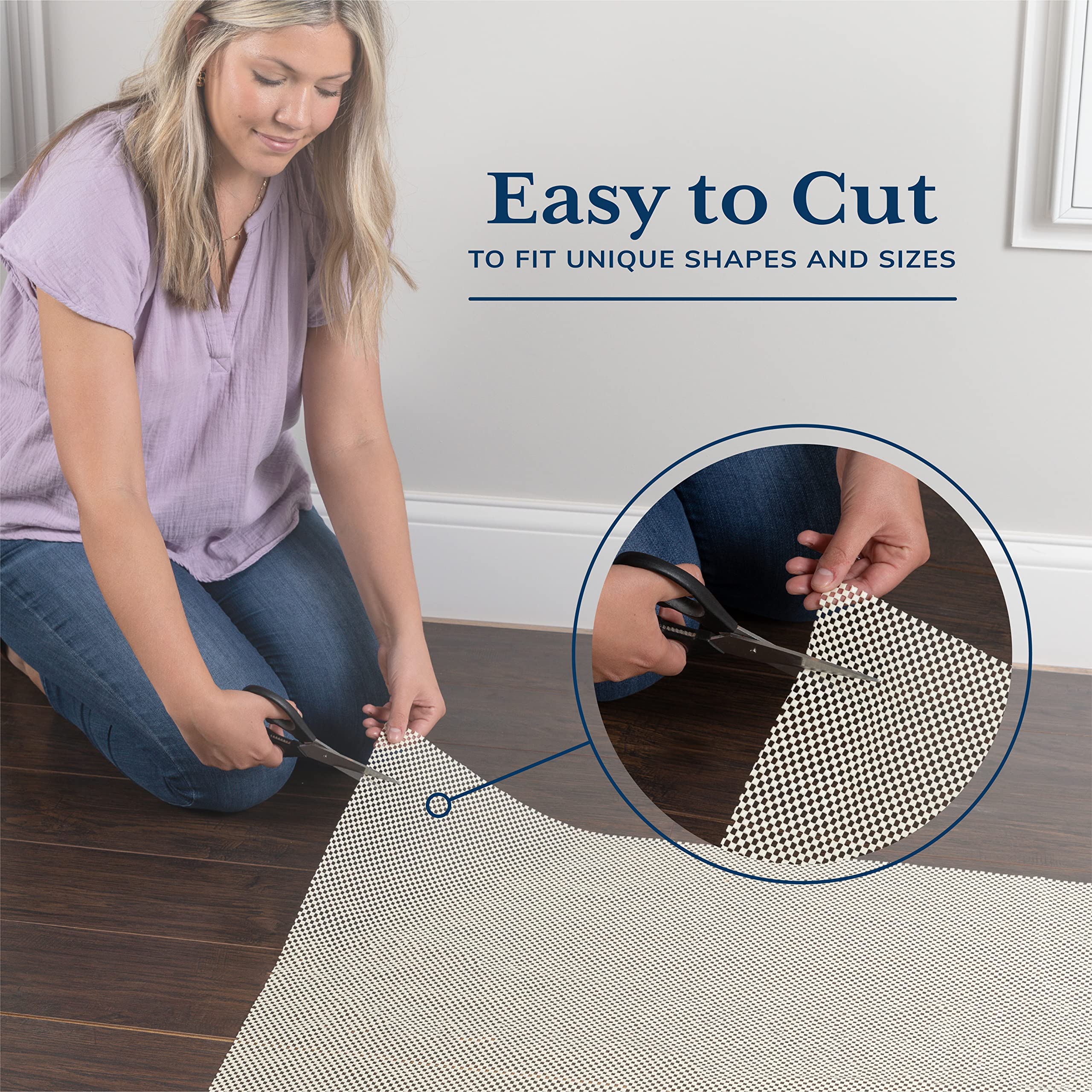 Veken trimmed rug pad edge being cut with scissors for fit