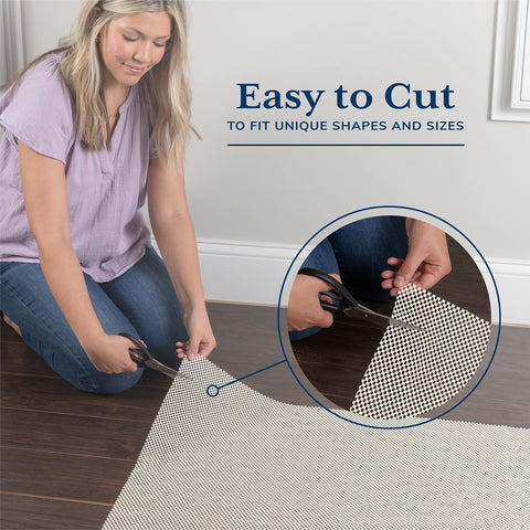 Veken trimmed rug pad edge being cut with scissors for fit