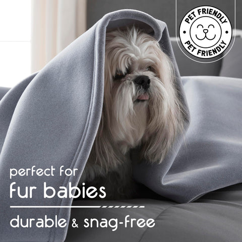 Vellux blanket draped on sofa in living room offering comfort and design versatility