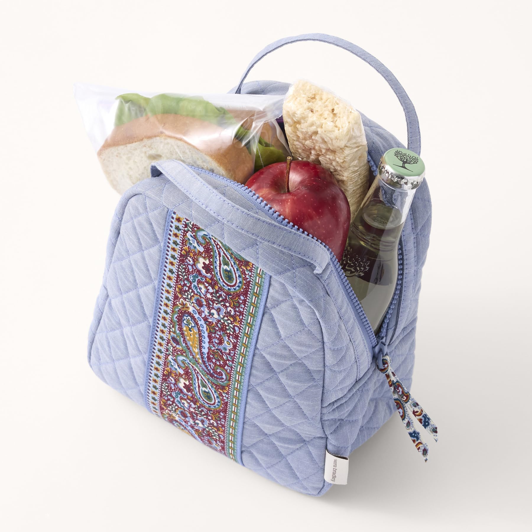 Vera Bradley lunch bag beside water bottle showing compact 7x9x4 inch scale