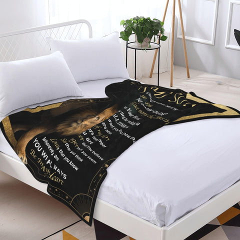 VESDEIN blanket styled on sofa demonstrating cozy everyday comfort