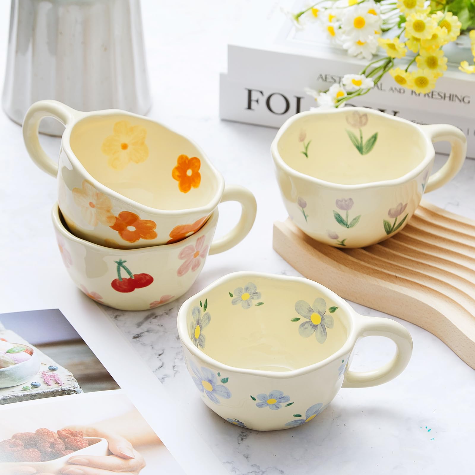 Vesici four mugs with spoons arranged on a wooden table, ideal for brunch styling