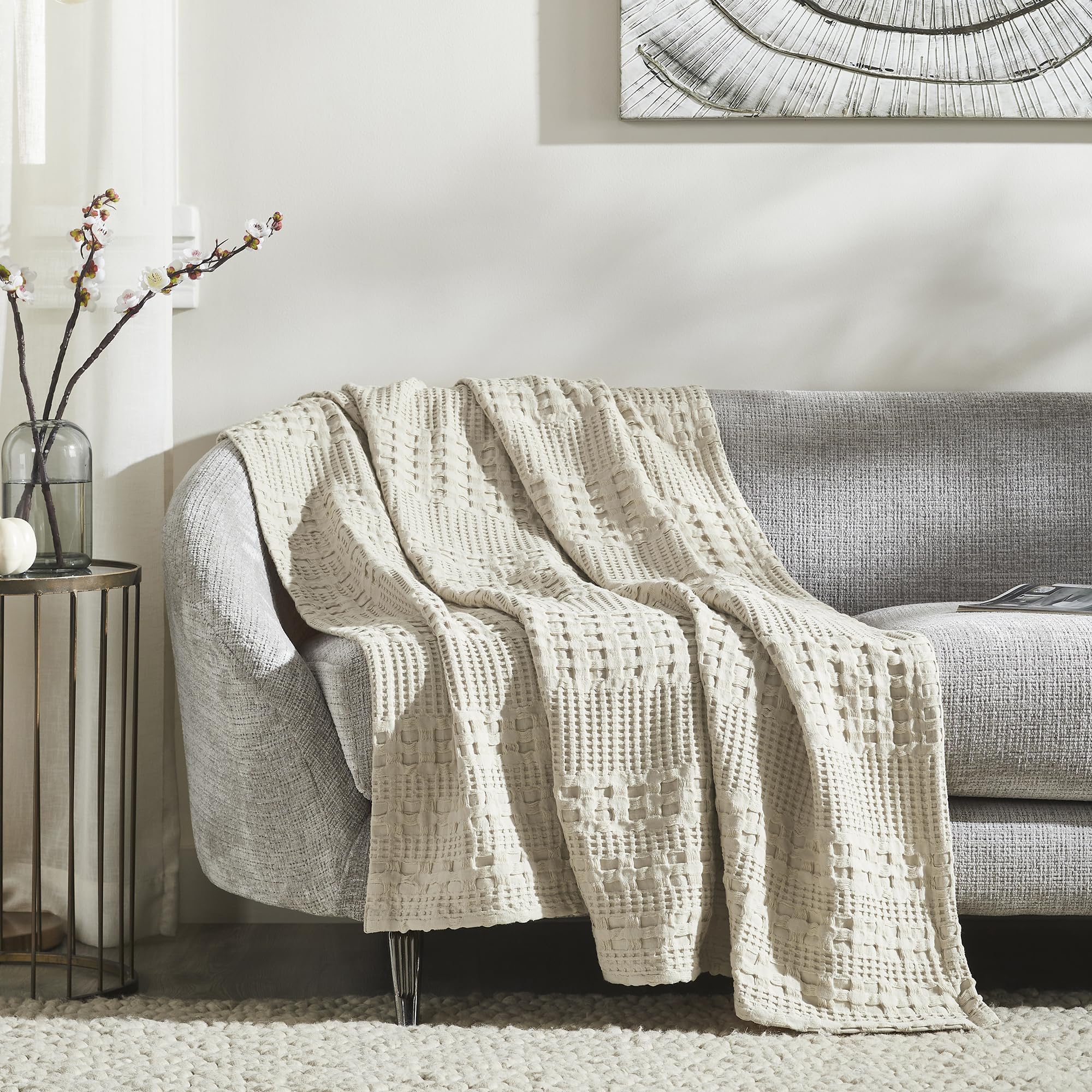 VHC Brands throw draped on sofa offering cozy layered living room appeal